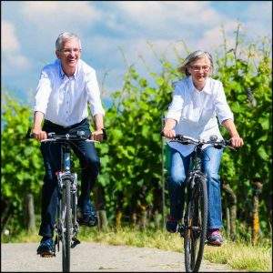 Couple taking a leisurely bicycle ride