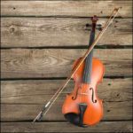 Violin on a wooden background